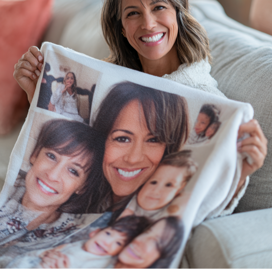 Woman holding a blanket with family photos printed on it
